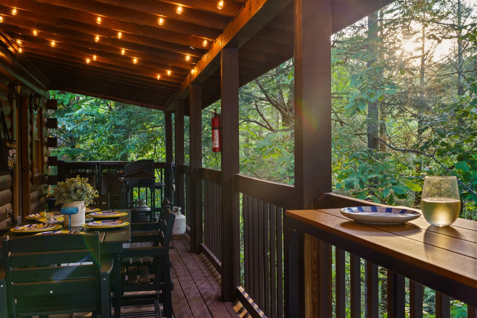 Outdoor dining table and high-top counter in late afternoon light